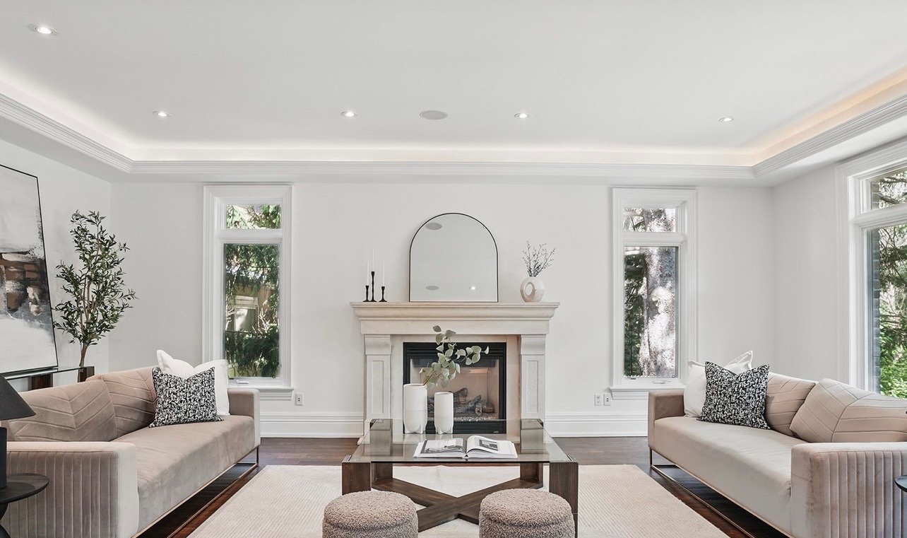 Freshly painted living room with marble fireplace